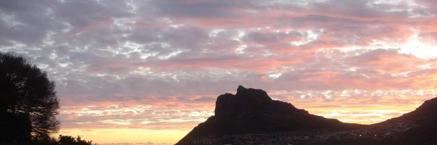 Pink evening sky over the silhouette of the Sentinel