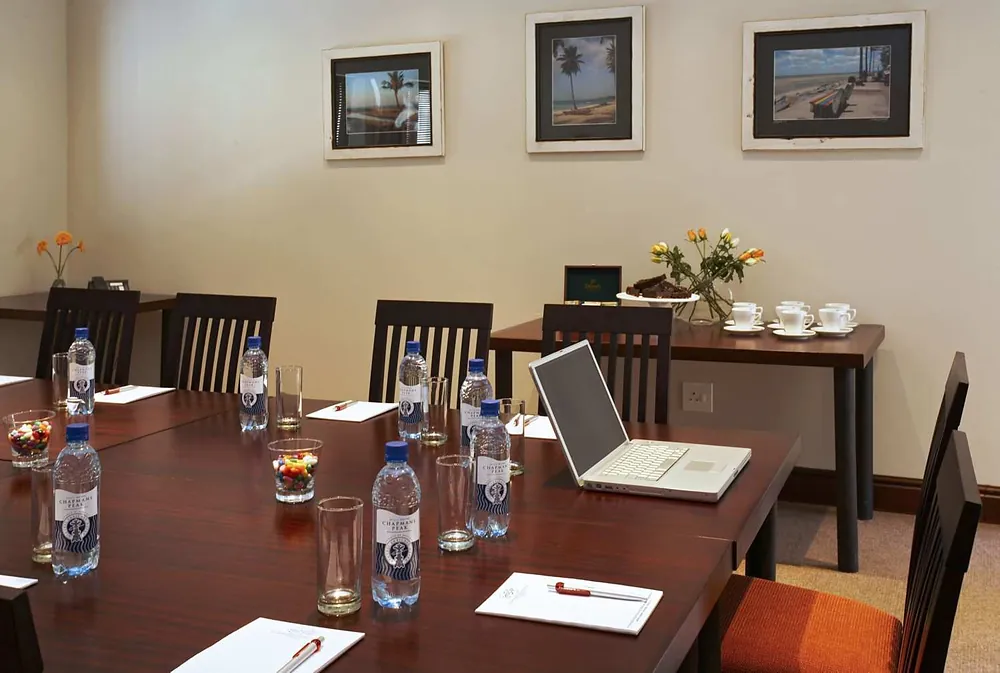 The Mountain Room with a boardroom table, laptops and water