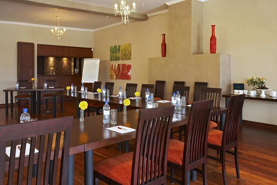 The Sentinel Room set for a meeting, with orange chairs and a long table